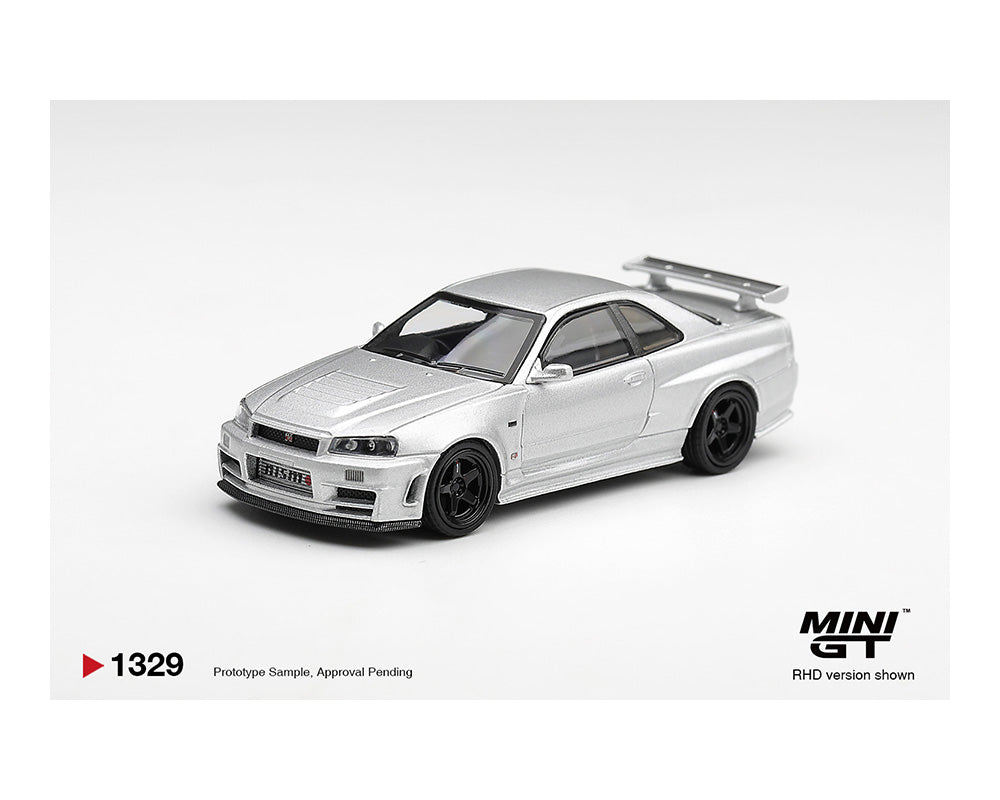 Model car of a silver sports car on a white background with MINI GT branding.