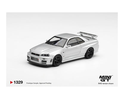 Model car of a silver sports car on a white background with MINI GT branding.