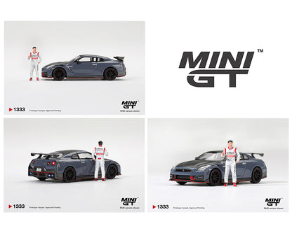 MINI GT MGT01333-R Nissan GT-R R35 NISMO Special Edition Stealth Gray with driver figure 1:64 diecast model, shown from a left side profile in right-hand drive configuration with carbon fiber accents, red trim, rear wing and authentic NISMO detailing.