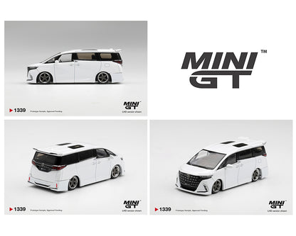 MINI GT 1:64 Toyota Alphard in pearl white with a lowered stance, custom body kit, black grille, silver deep-dish wheels, dual sunroofs, and rear spoiler. Product code MGT01339-BL. Prototype diecast model shown from side, front, and rear three-quarter views.