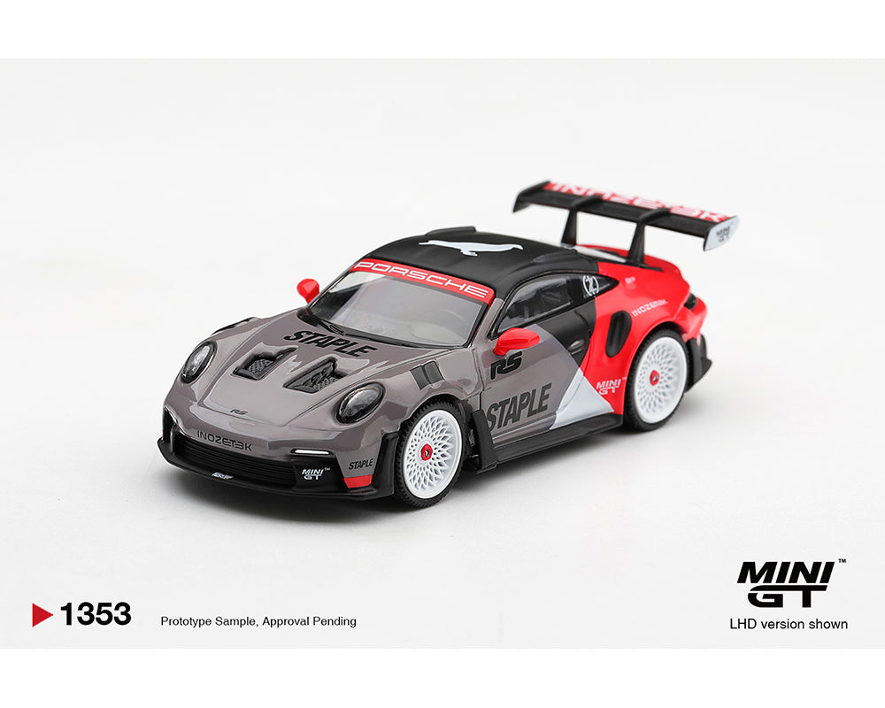 MINI GT 1:64 Porsche 911 GT3 RS STAPLE Racing Livery MGT01353-BL Grey Red Black Diecast Model Car Front Three Quarter View with White Multi-Spoke Wheels, Carbon Black Roof and Large Rear Wing