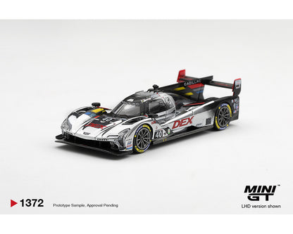 A scale model of a ZR1 race car from the brand MINI GT, featuring a silver, black, and white livery with red and yellow accents. The model is displayed on a clean white background with product information text overlays at the bottom.
