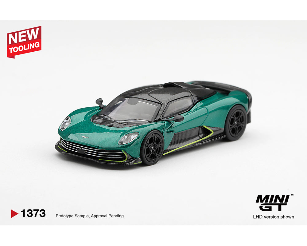 A green and black Aston Martin Vantage LHD diecast model car on a white background, featuring 'NEW TOOLING' and 'MINI GT' branding overlays.