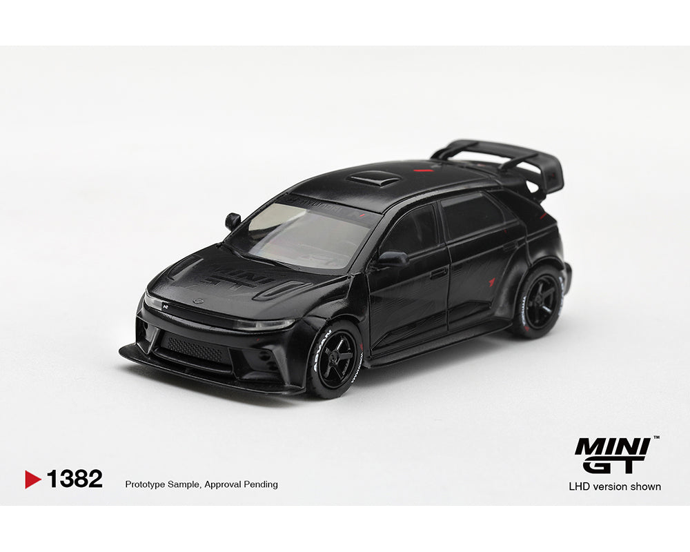 Mini GT 1:64 Honda Civic Type R FL5 Black MGT01382-BL diecast model with black wheels and large rear wing, front three-quarter view.