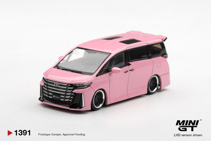 MINI GT 1:64 Toyota Alphard pink diecast model with lowered stance, custom black wheels, black grille and sunroof, front three-quarter view