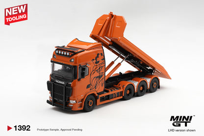 MINI GT 1:64 Scania orange flatbed recovery truck diecast model MGT01392 with raised tilting bed, hydraulic lift, black bull bar and custom graphics, front three-quarter view