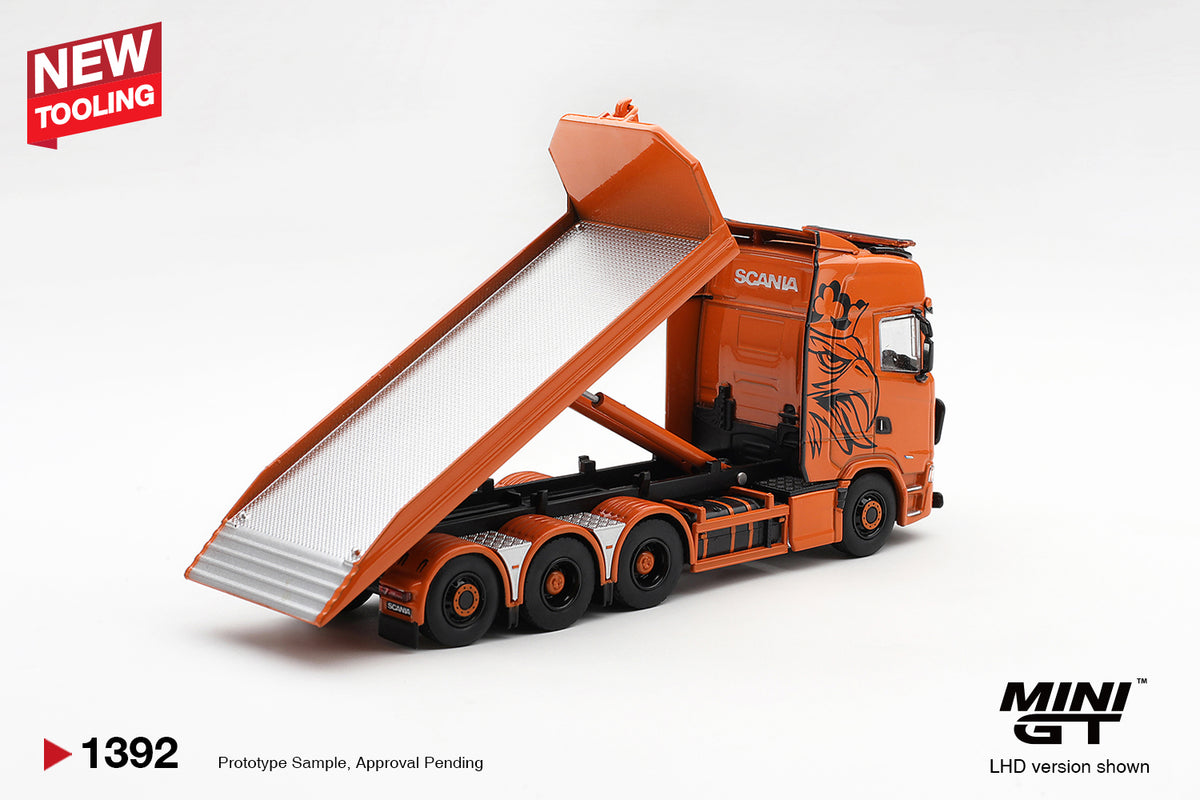 MINI GT 1:64 Scania orange flatbed recovery truck diecast model MGT01392 with raised tilting loading bed, silver loading platform and hydraulic lift, rear three-quarter view