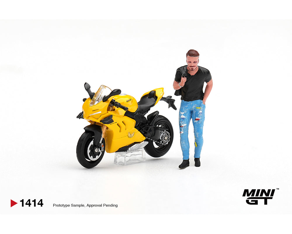 MINI GT 1:64 Ducati Panigale Yellow Sport Motorcycle MGT01414-L Diecast Model Bike Front Three Quarter View with Standing Male Figure Wearing Black Shirt and Blue Jeans