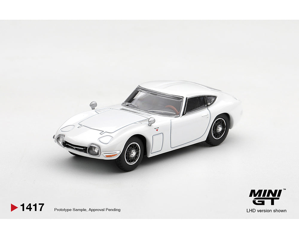 MINI GT 1:64 Toyota 2000GT White MGT01417-BL Diecast Model Car Front Three Quarter View Featuring Classic Japanese Sports Car Design, Chrome Details and Black Wheels