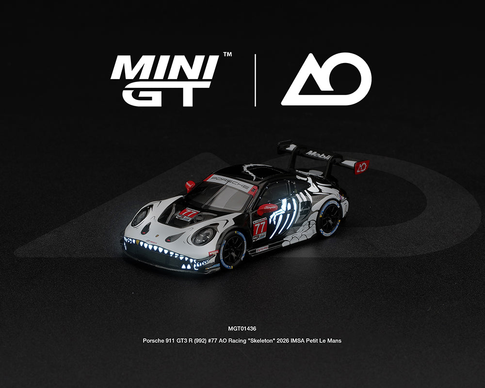 Mini GT 1:64 Porsche 911 GT3 R 992 #77 AO Racing Skeleton Rexy 2026 IMSA Petit Le Mans diecast model with glow-in-the-dark skeleton livery, MGT01436-BL.