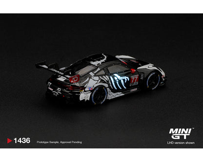 Mini GT 1:64 Porsche 911 GT3 R (992) #77 AO Racing Skeleton Rexy 2026 IMSA Petit Le Mans MGT01436-BL diecast model, rear three-quarter view featuring black and white skeleton livery, illuminated blue graphics and racing rear wing.