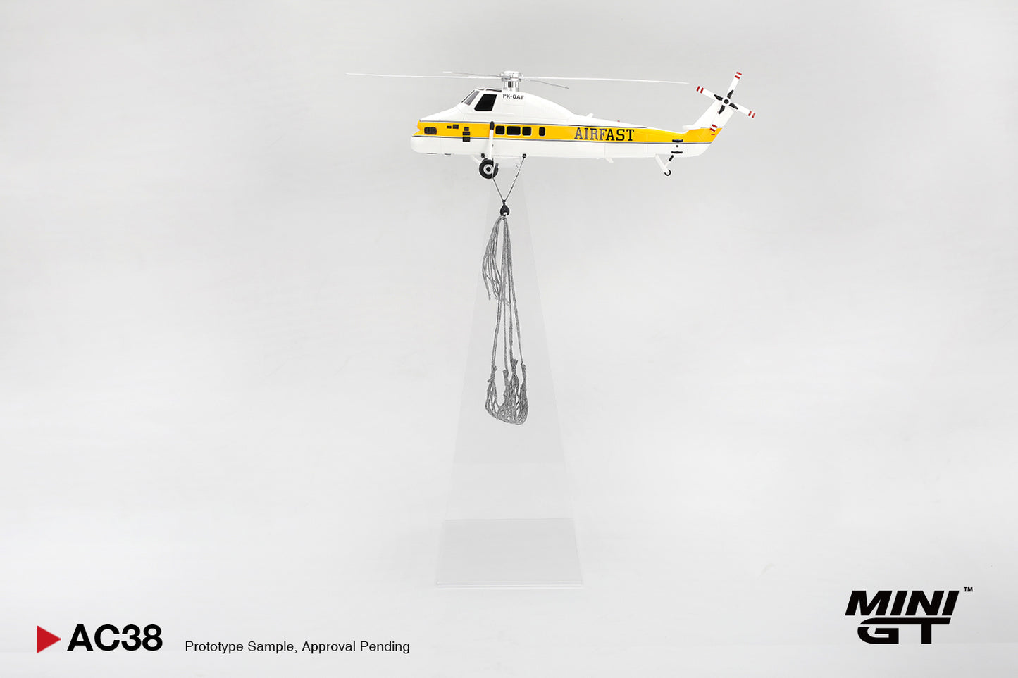 Model helicopter with 'FAST' branding on a gray background, featuring the Mini GT brand.