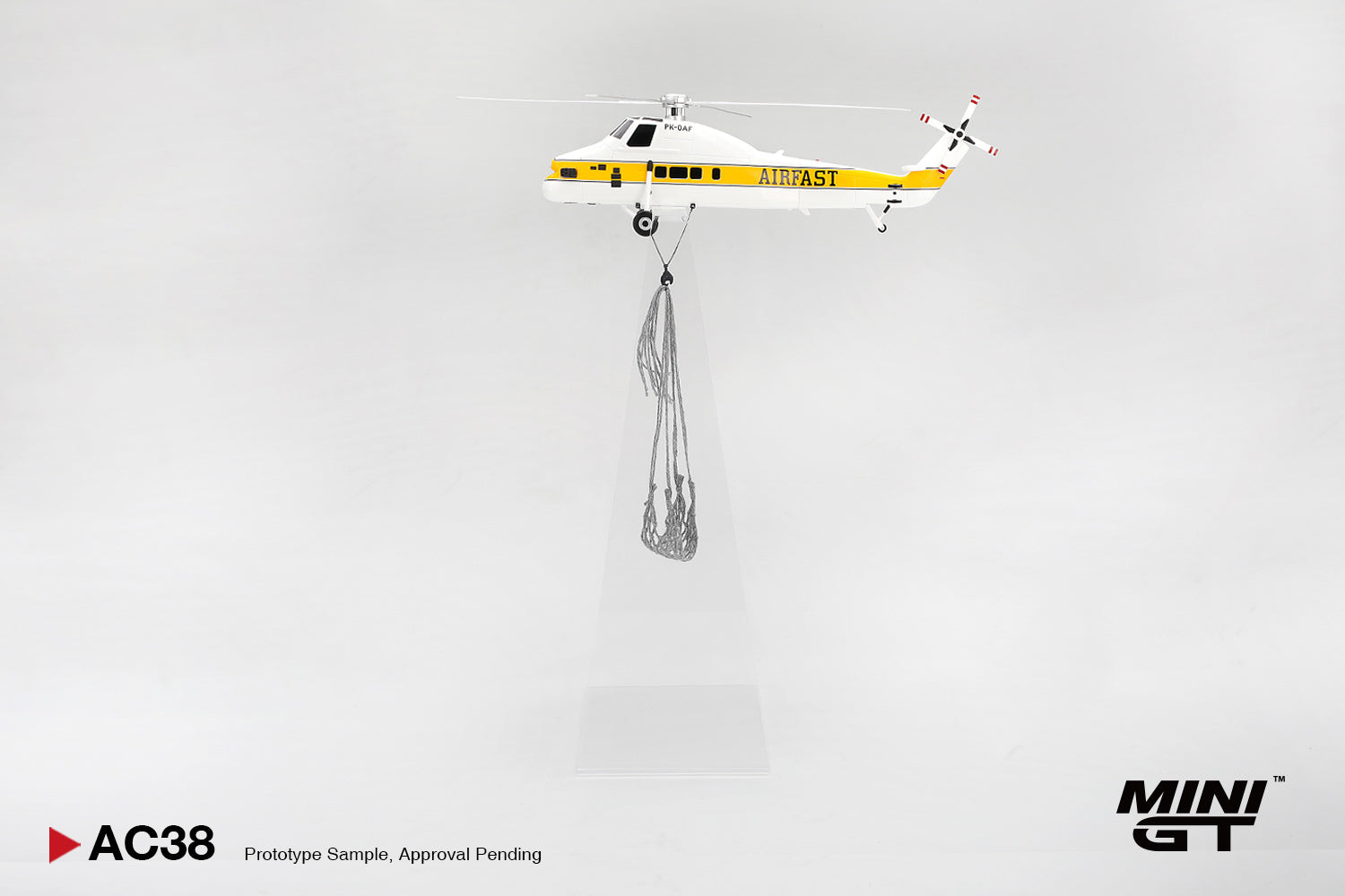 Model helicopter with 'FAST' branding on a gray background, featuring the Mini GT brand.