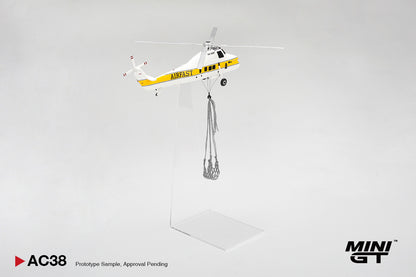 Model helicopter with a payload on a gray background, featuring the Mini GT brand.