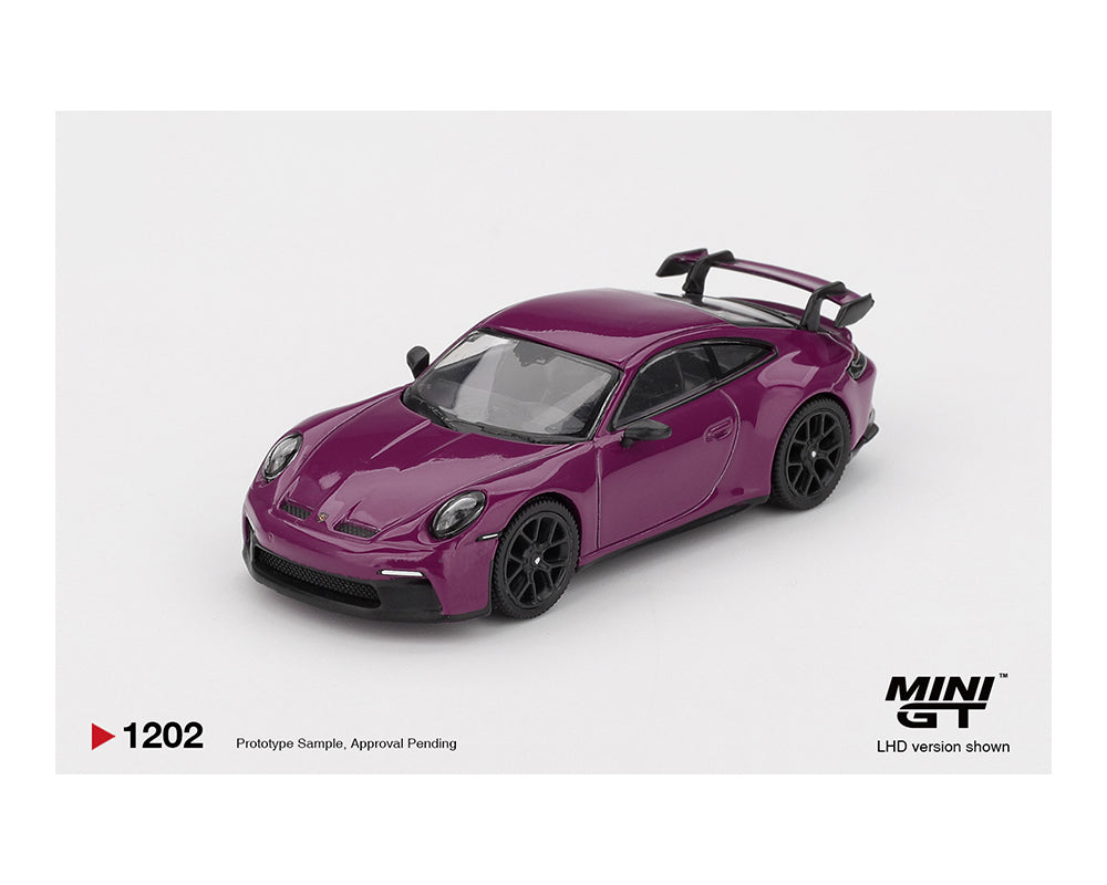 Purple sports car model on a white background with MINI GT branding.