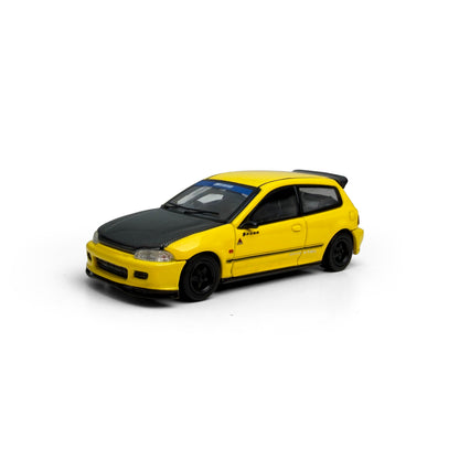 Yellow model car with black accents on a white background
