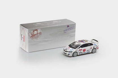 A small white die-cast rally car model with colorful racing decals is shown next to its silver and white product box on a clean light gray background.