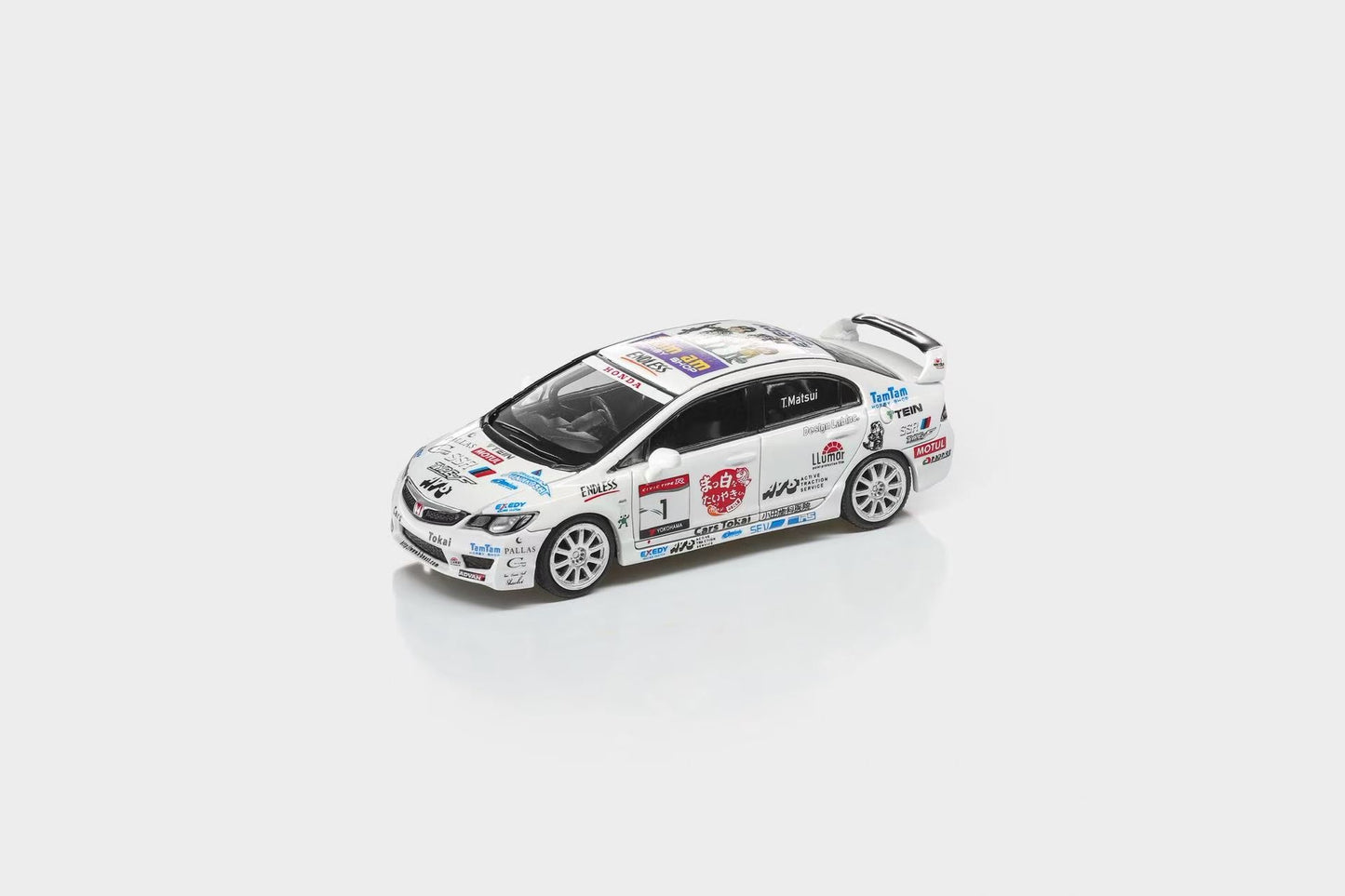 Model car with various decals on a white background