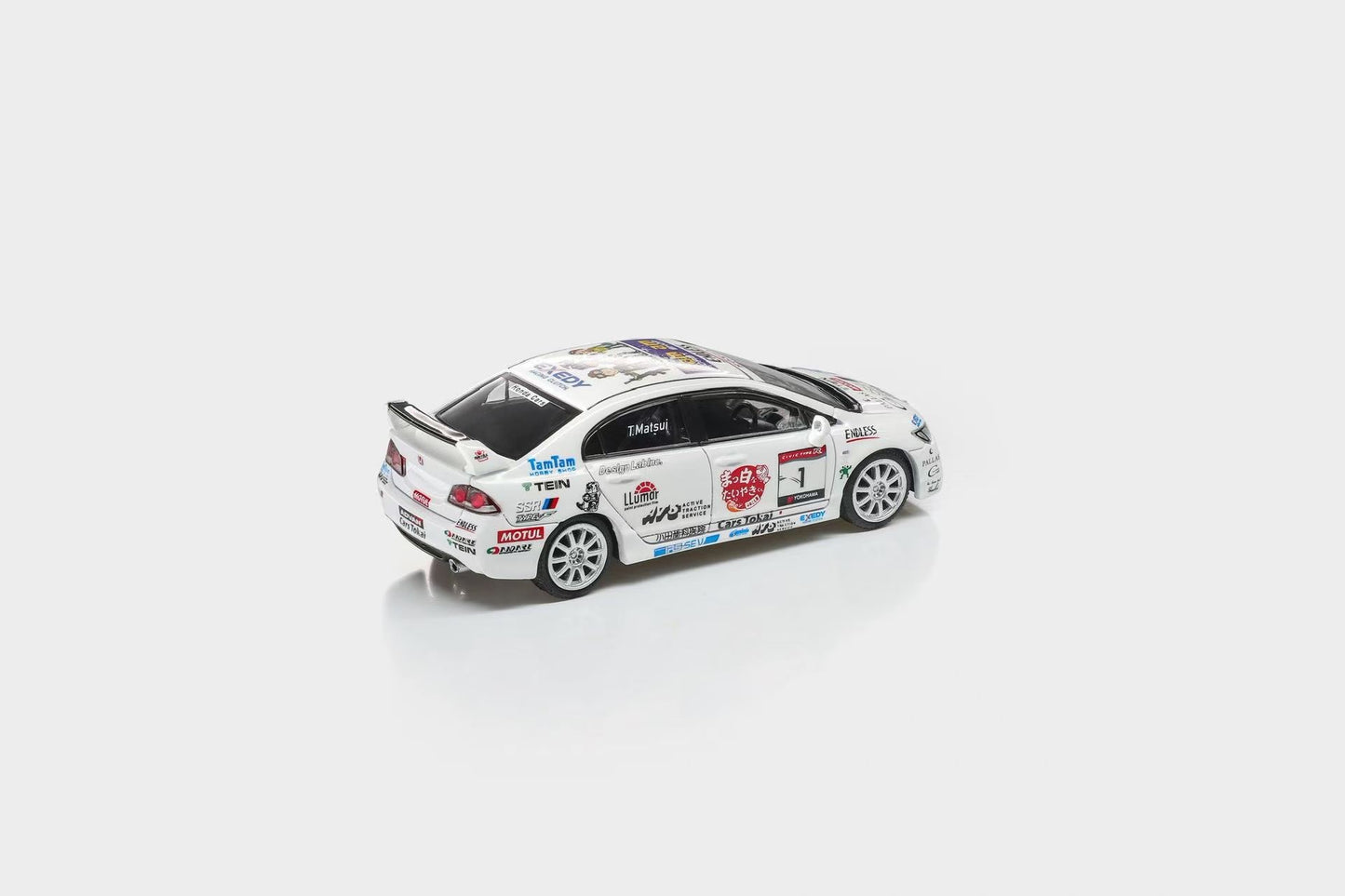 Model car with various sponsor logos on a white background