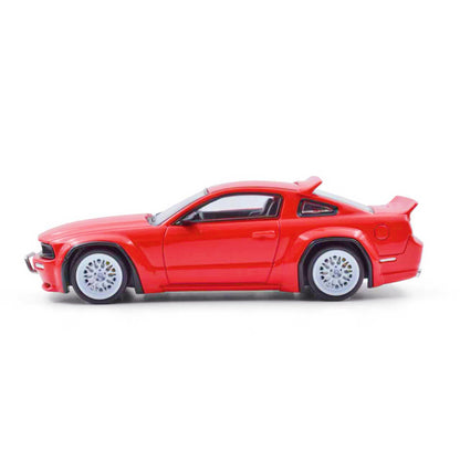 Red toy car on a white background