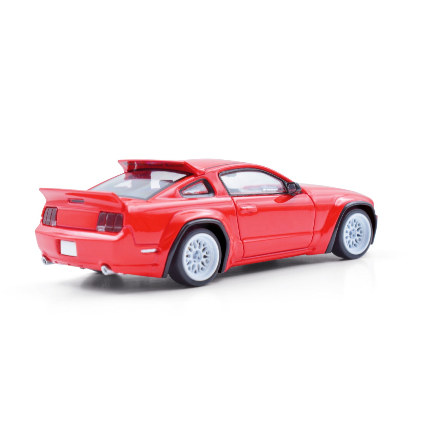 Red toy car on a white background