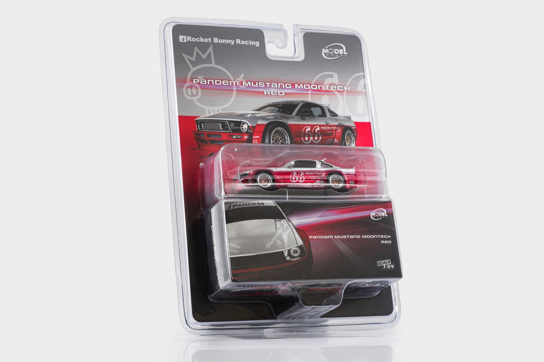 A packaged die-cast model car in a clear blister pack on a white background. The product is a Rocket Bunny Racing No.