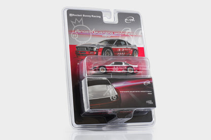 A packaged die-cast model car in a clear blister pack on a white background. The product is a Rocket Bunny Racing No.