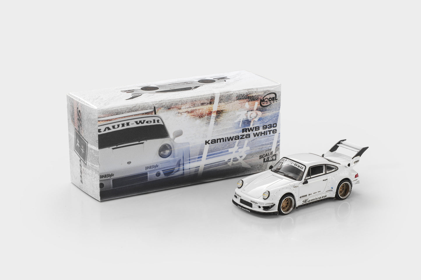 A white Tamiya model car, RWD 930 Kamiwaka White, shown next to its original packaging box on a light gray background.