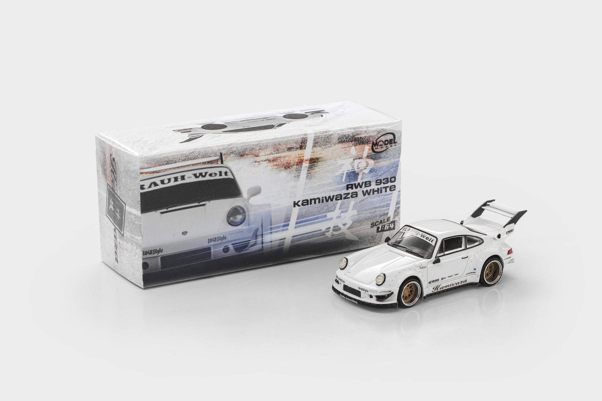 A white Tamiya model car, RWD 930 Kamiwaka White, shown next to its original packaging box on a light gray background.