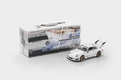 A white Tamiya model car, RWD 930 Kamiwaka White, shown next to its original packaging box on a light gray background.