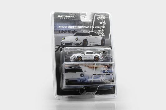 A packaged miniature die-cast model car from Raum-Wheel, specifically the RWD 930 Kimiwaza White. The product is shown in its original blister pack with printed packaging graphics depicting the full car and its livery details.