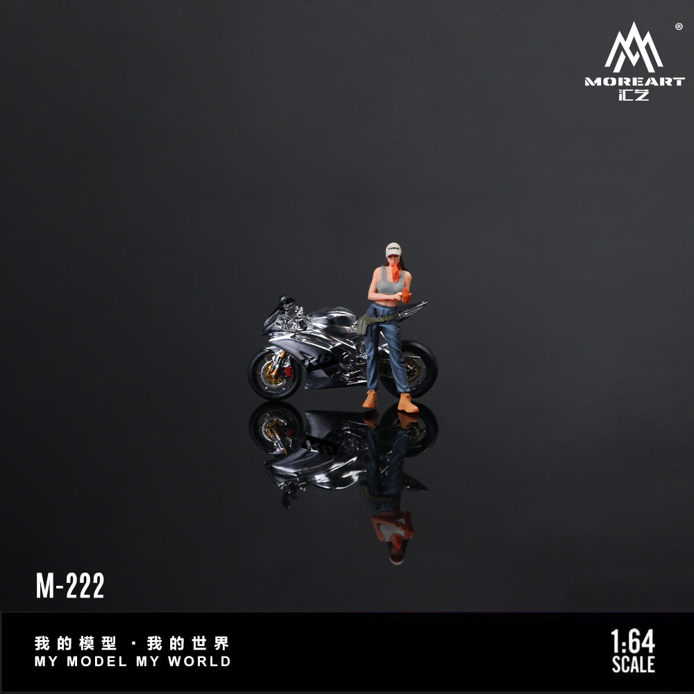 Model figure of a person with a motorcycle on a reflective surface with 'MOREART' branding.