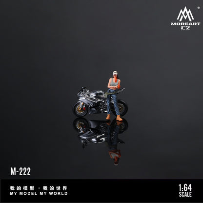 Model figure of a person with a motorcycle on a reflective surface with 'MOREART' branding.