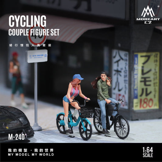 MoreArt 1:64 Cycling Couple Figure Set M-240 featuring two miniature figures riding bicycles in a realistic street scene, designed for 1:64 scale diecast model car dioramas, city displays and miniature collections.