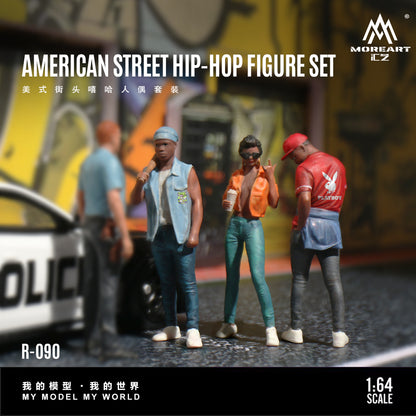 Model figure set of four people in street hip-hop attire with a police car and graffiti background, brand 'MoreArt' visible.