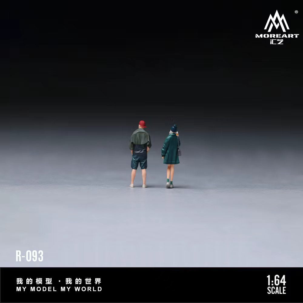 Two miniature figures standing on a gray surface with 'MOREART' branding.