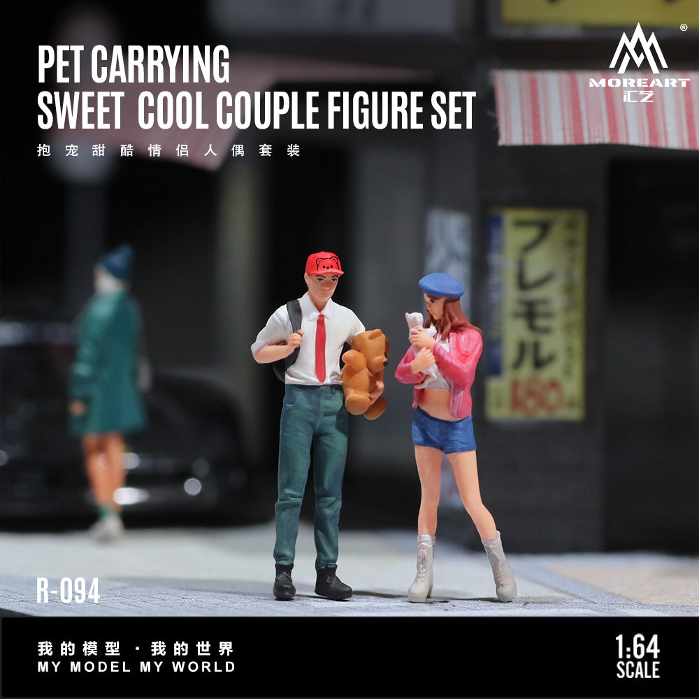 Model figure set of a couple with a pet, standing on a street with blurred background
