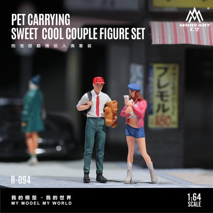 Model figure set of a couple with a pet, standing on a street with blurred background