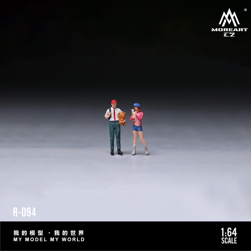 Two miniature figures standing on a gray surface with a dark background, featuring the brand 'MOREART'.