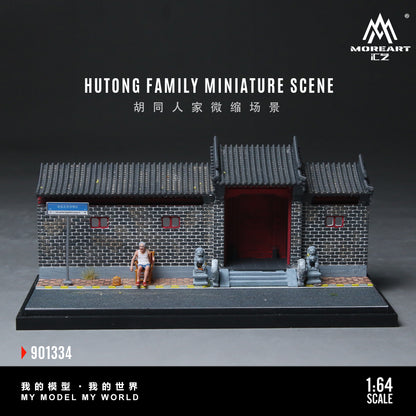Miniature model of a hutong family scene with traditional Chinese architecture on a dark background.