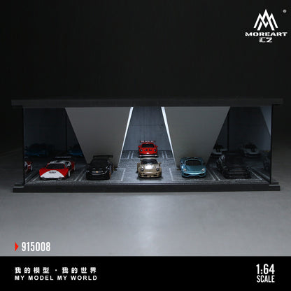 Model car garage display with multiple cars inside, featuring the MoreArt CZ brand.