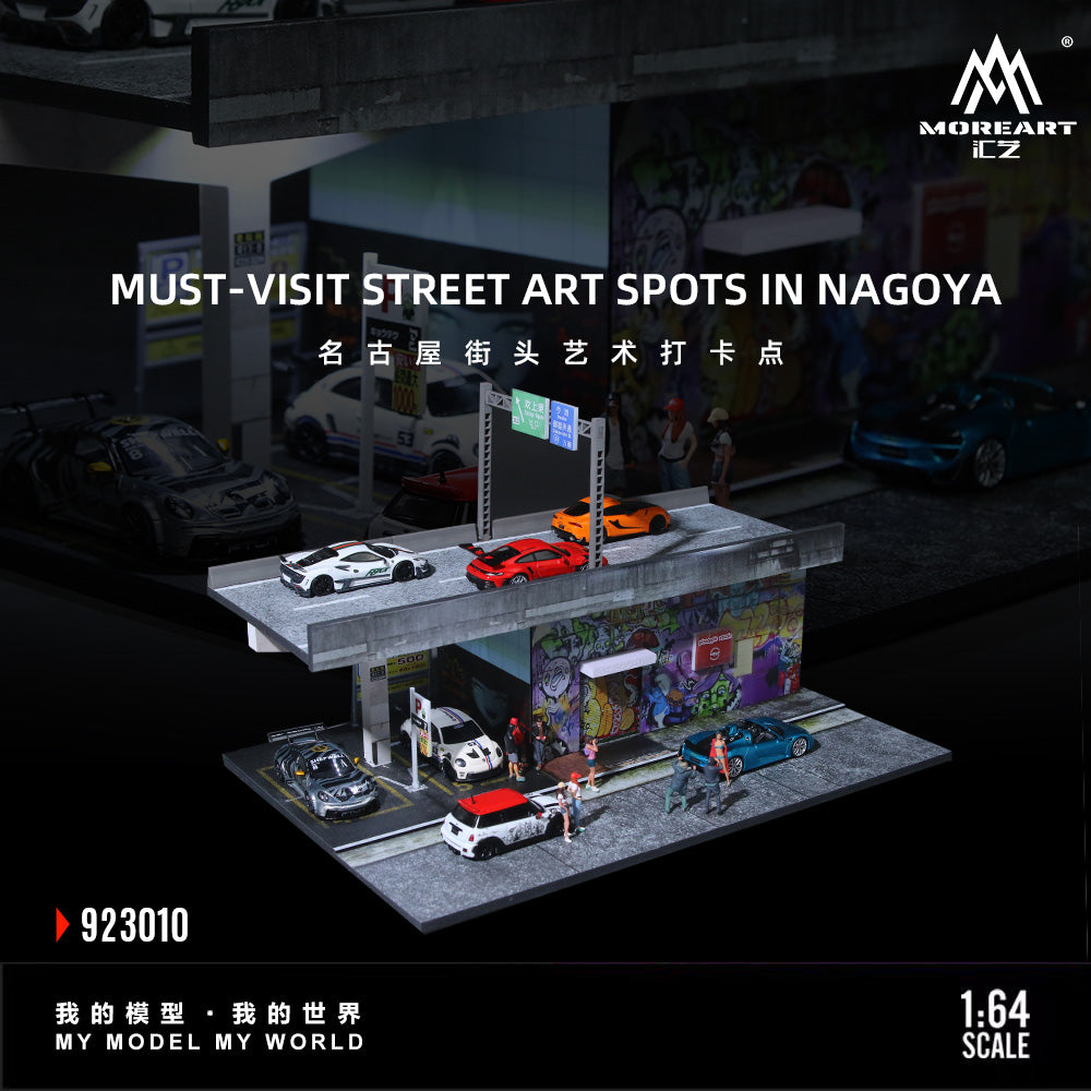 Model street scene with cars and street art in Nagoya, featuring MOREART CZ branding.