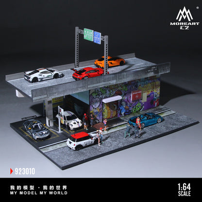 Model street scene with cars and street art in Nagoya, featuring MOREART CZ branding.