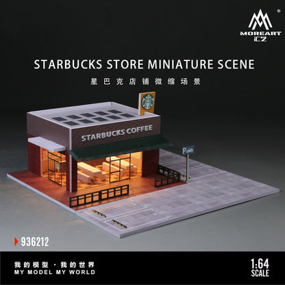 Model of a Starbucks store miniature scene with glowing interior lights on a dark background.