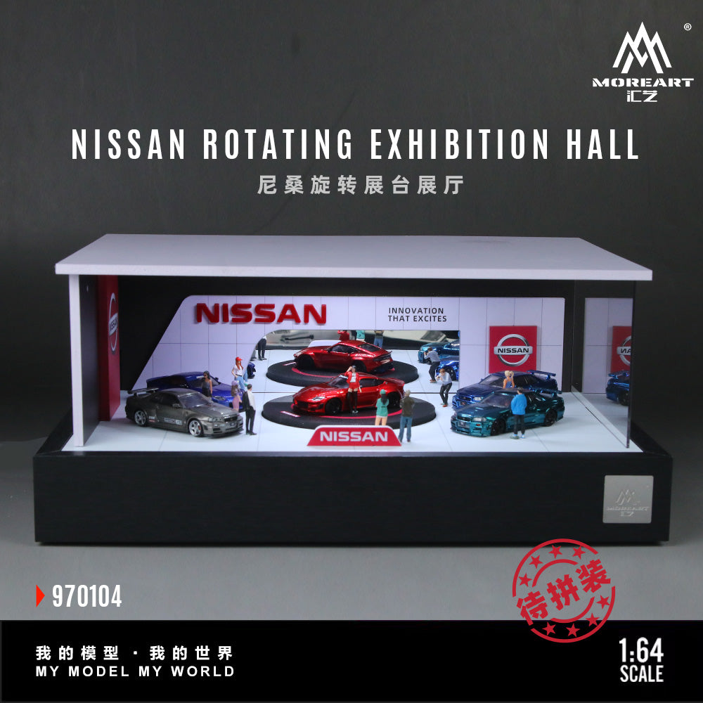 Model of a Nissan rotating exhibition hall with cars and people on a gray background