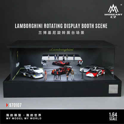 MoreArt 1:64 Lamborghini Rotating Display Booth Scene 970107, featuring a black Lamborghini-themed showroom diorama with illuminated interior, Lamborghini branding, mirrored rear wall, central rotating display platform, and spacious exhibition area showcasing multiple 1:64 scale diecast cars and miniature figures.