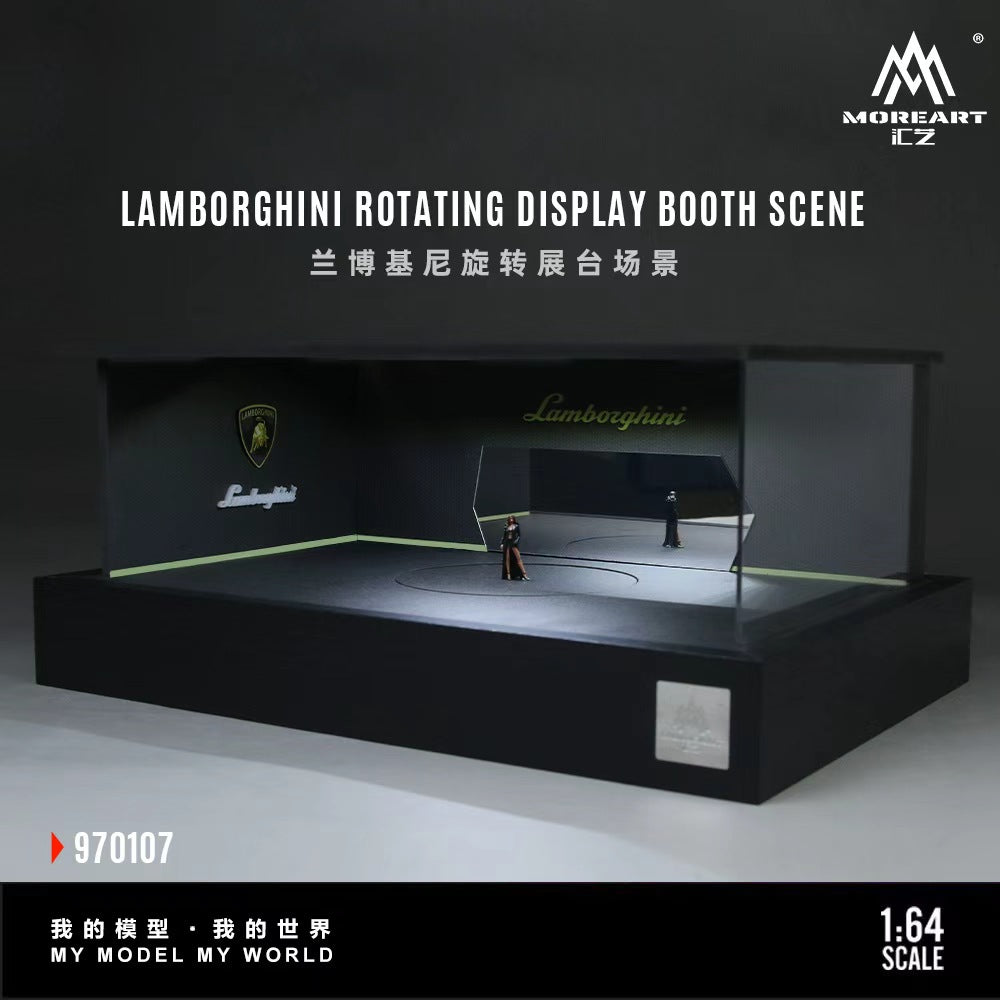 MoreArt 1:64 Lamborghini Rotating Display Booth Scene 970107, featuring a black Lamborghini-themed showroom diorama with illuminated Lamborghini logos, green accent lighting, mirrored rear wall, central rotating display platform, transparent side panels, and a modern exhibition booth design for 1:64 scale diecast model cars.