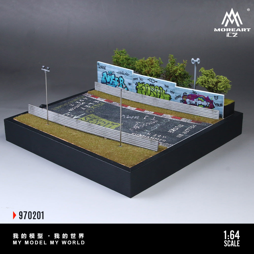 Model of a race track with cars and grass, featuring a brand logo.