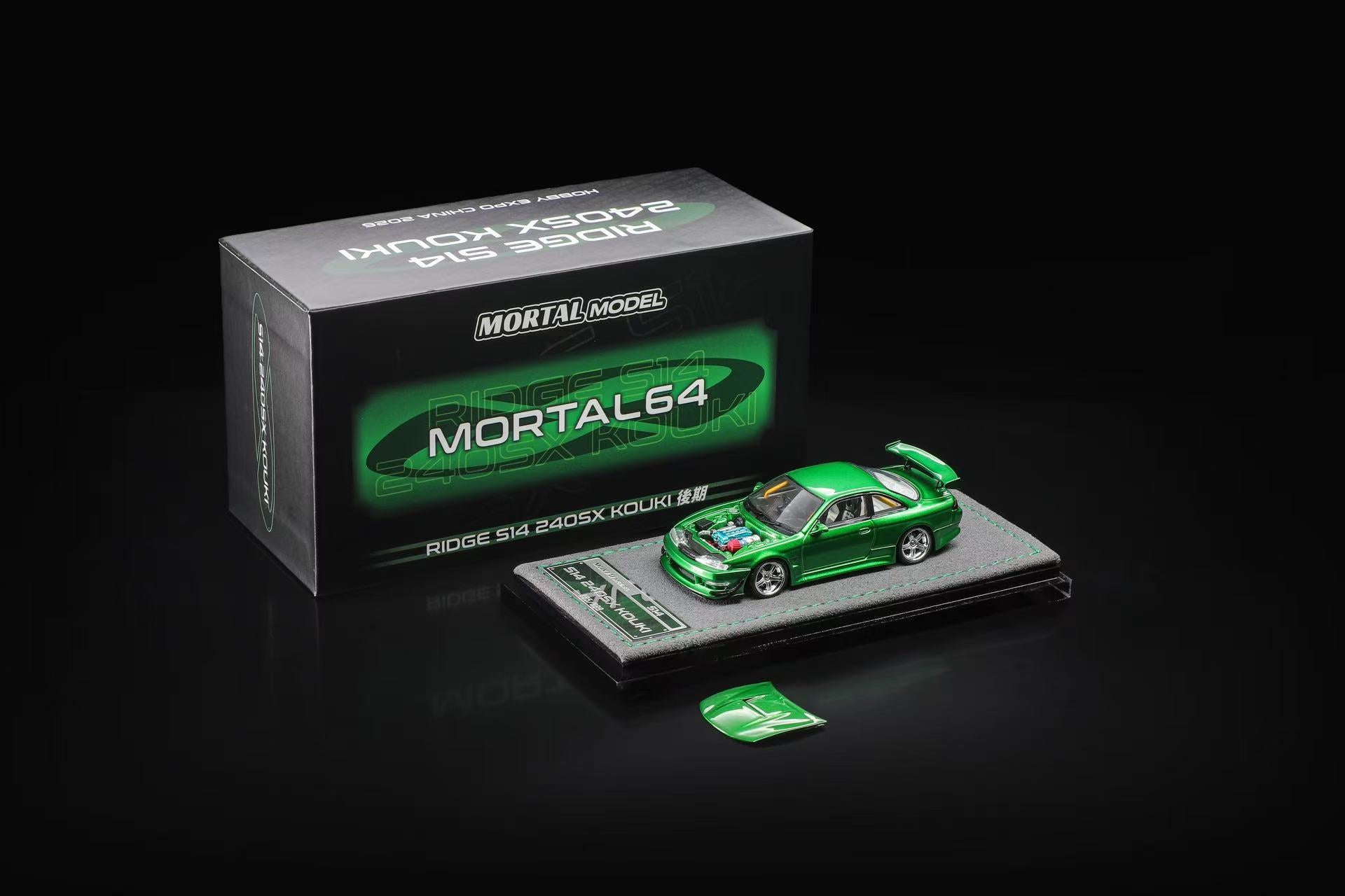 Mortal Model 1/64 scale model car, Ridge RM 240SX Round RM, in metallic green, displayed next to its black and green product box on a black reflective surface.