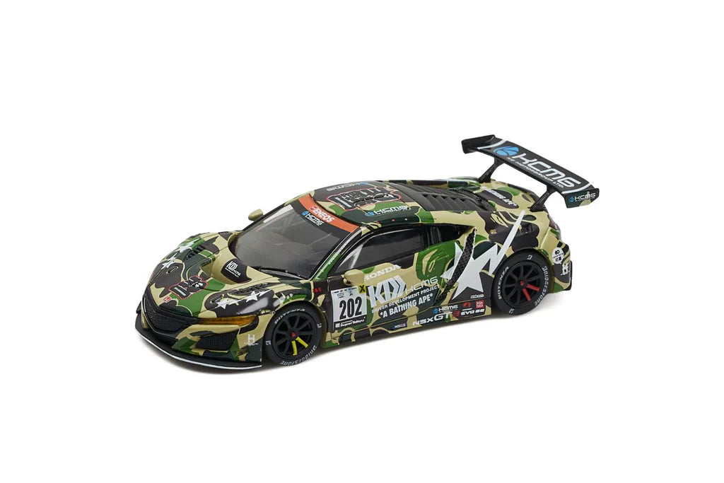 Camouflage-themed model sports car with a large rear spoiler, showcasing racing decals and the number 202. The design exudes a bold, competitive vibe.